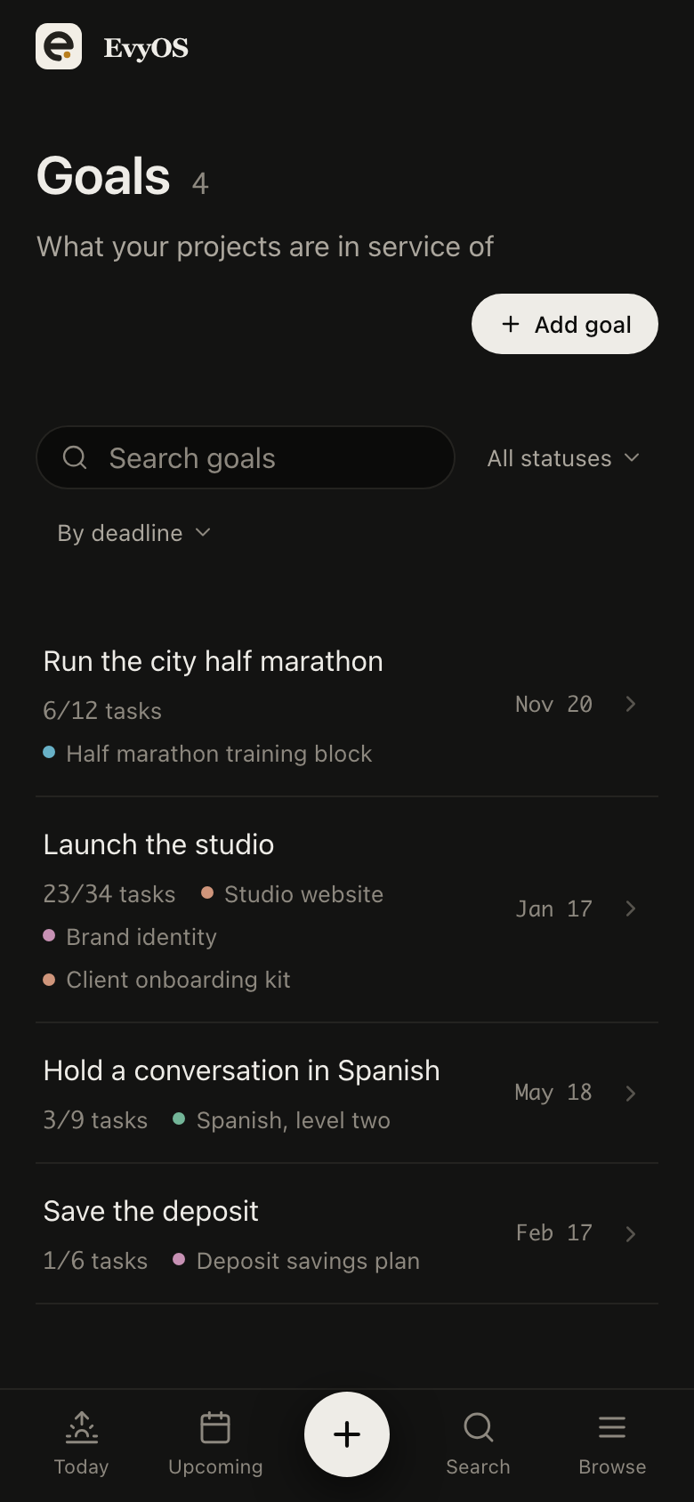 The goals list in EvyOS, each goal with its category, target date and the progress calculated from the work underneath it, on a phone
