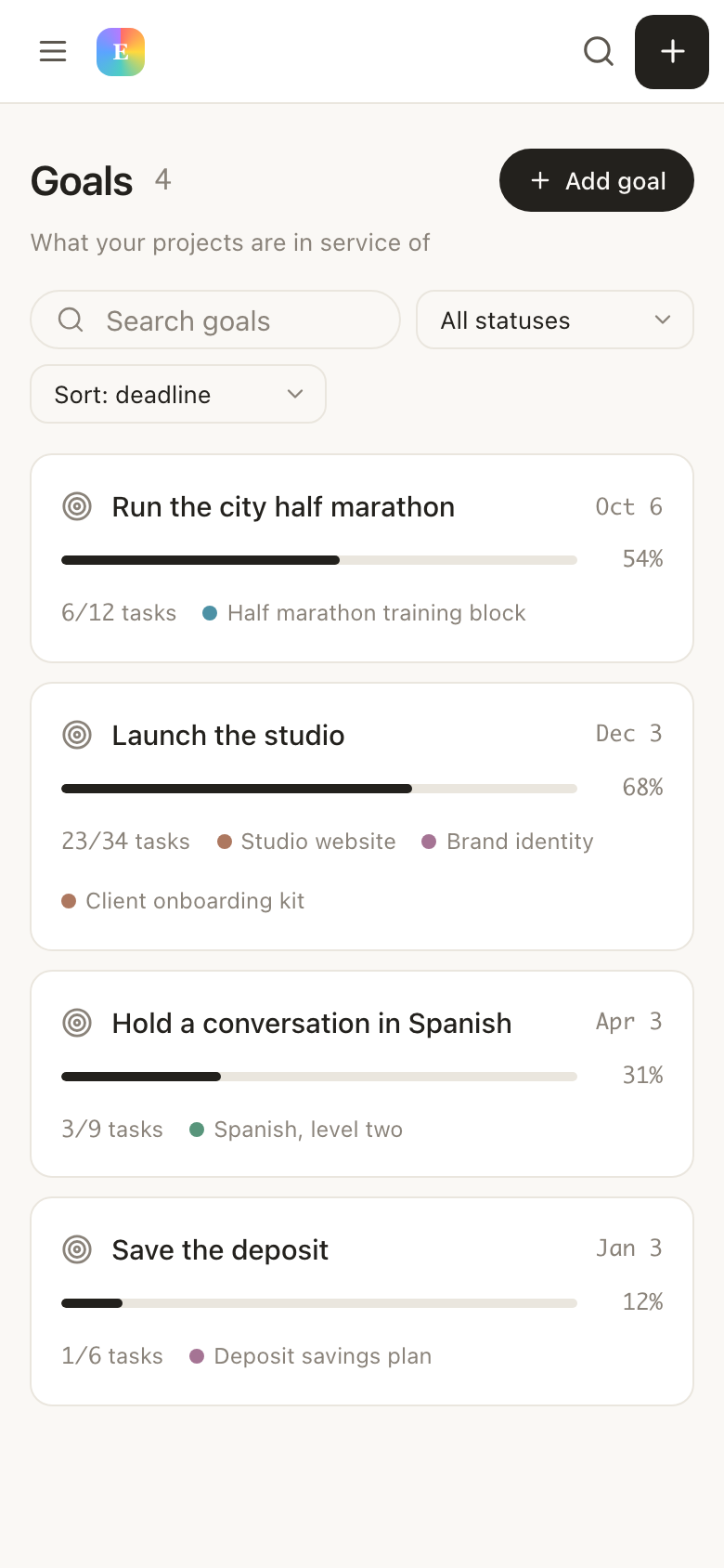 The goals list in EvyOS, each goal with its category, target date and the progress calculated from the work underneath it, on a phone