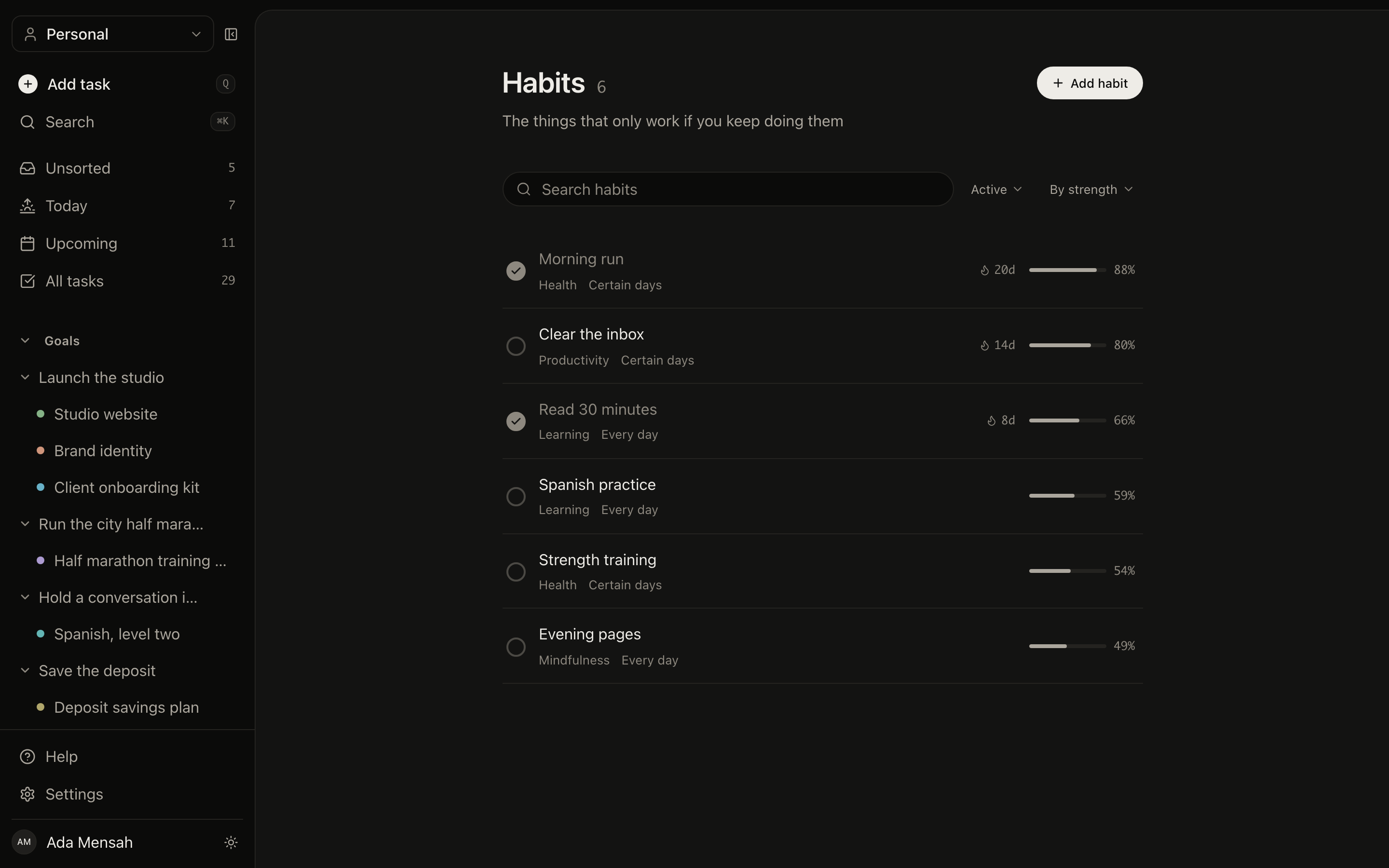 The habits screen in EvyOS, with each habit's schedule, current streak and recent completions shown as a row